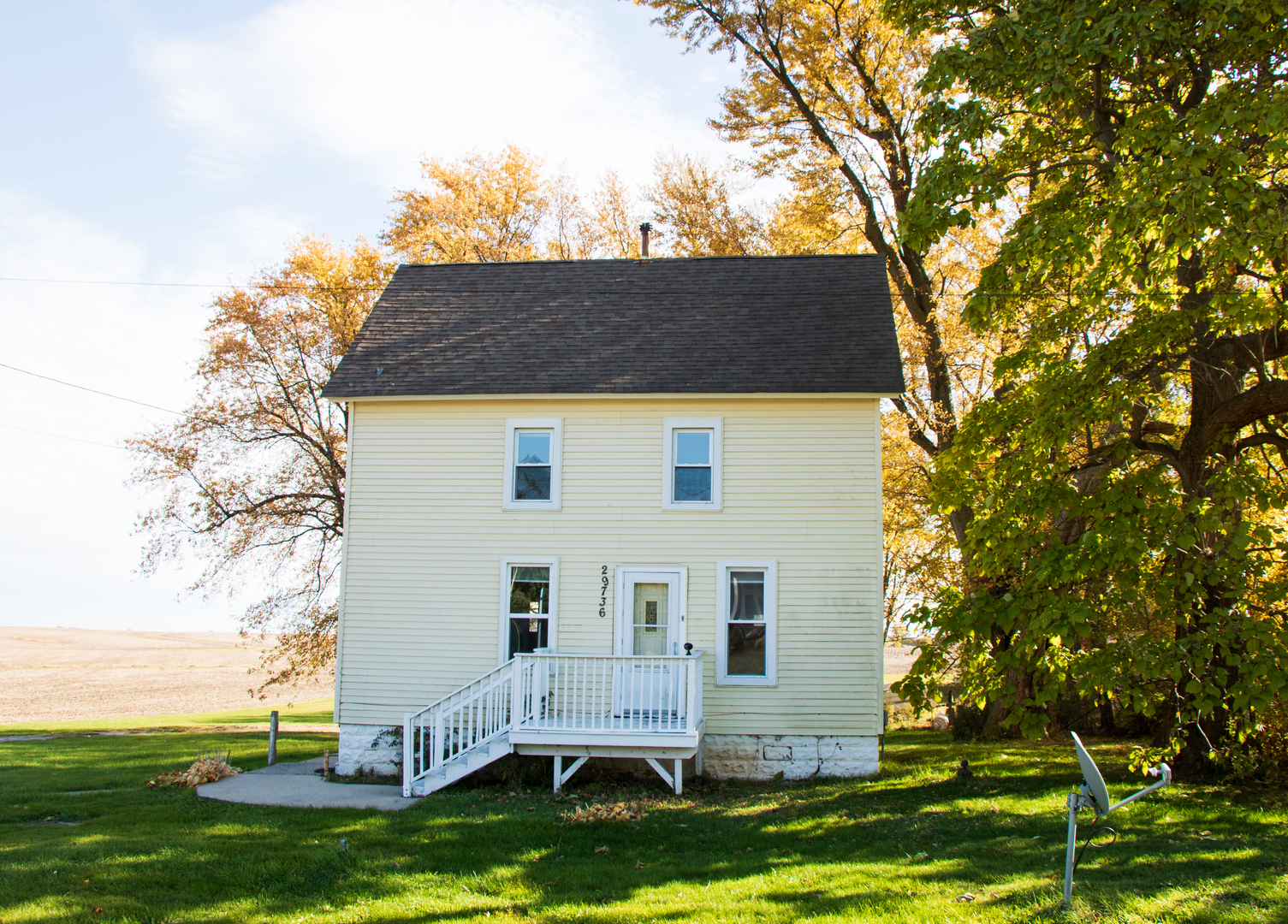 a view of house with backyard