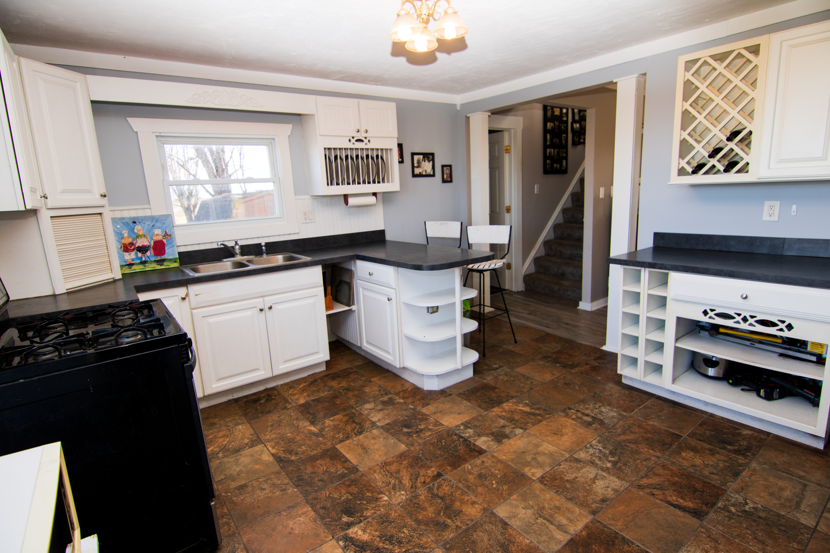 29736 Highway 23 Genoa, IL 60135 - Photo 9 of 16 a kitchen with a sink and a stove top oven