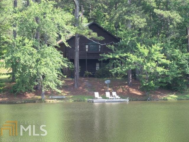 648 Pea Ridge Road Franklin, GA 30217 - Photo 1 of 1 a view of a house with a yard next to a lake