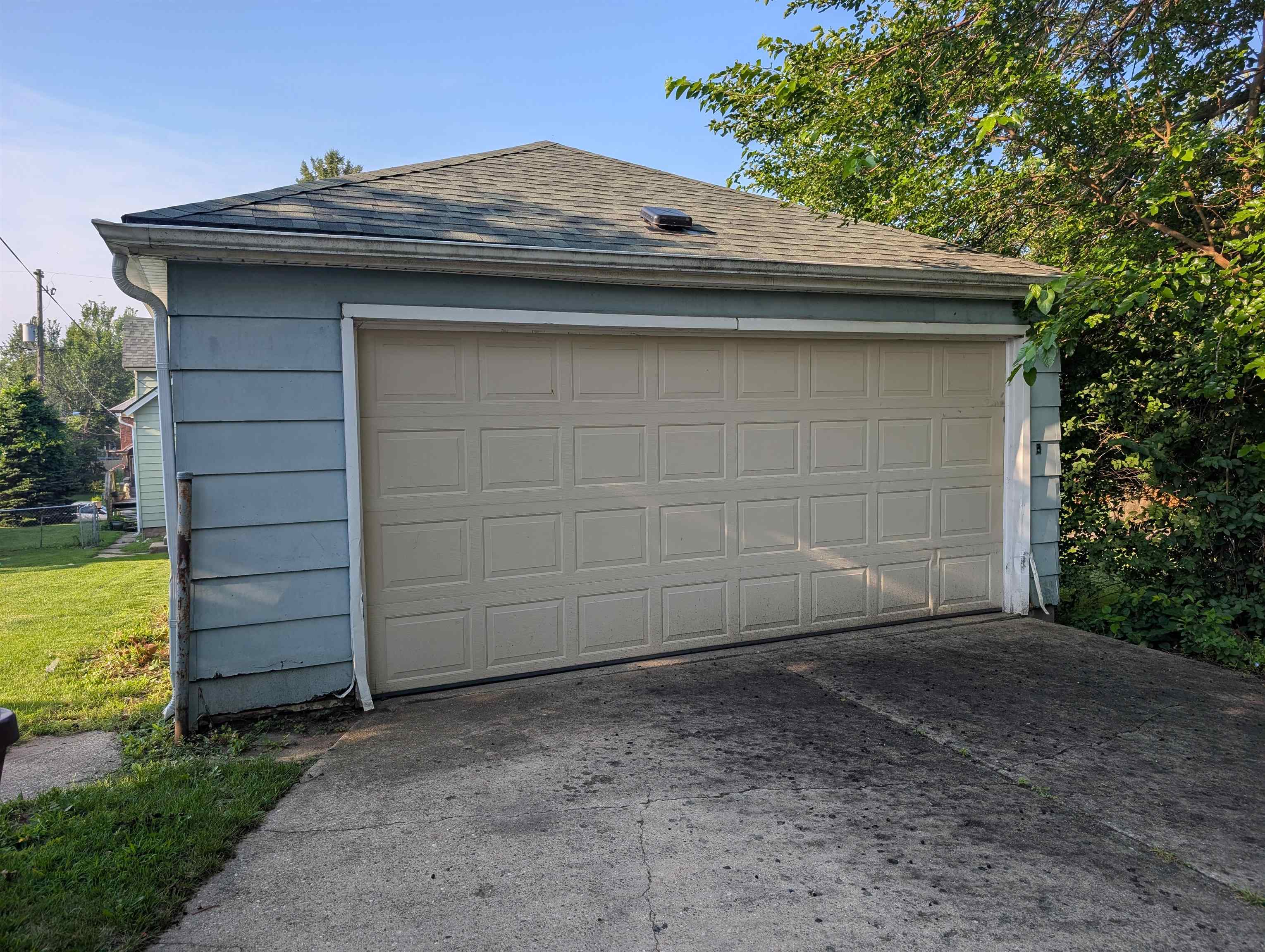 2208 13th Avenue Rockford, IL 61104 - Photo 4 of 5 a front view of a house with a garden