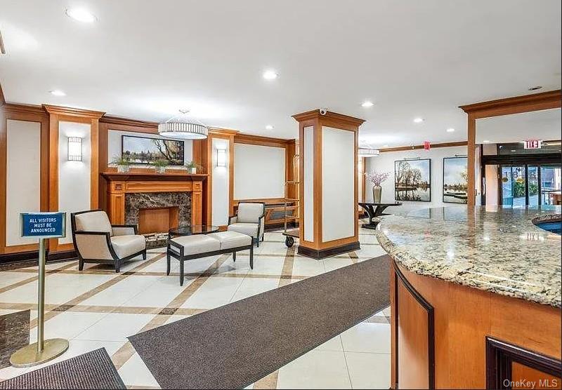 118-18 Union Turnpike, Unit 16A Queens, NY 11415 - Photo 4 of 13 a living room with furniture and a fireplace