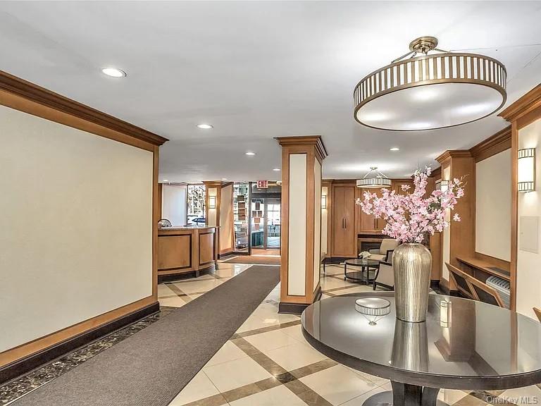 118-18 Union Turnpike, Unit 16A Queens, NY 11415 - Photo 6 of 13 a reception area with view of kitchen