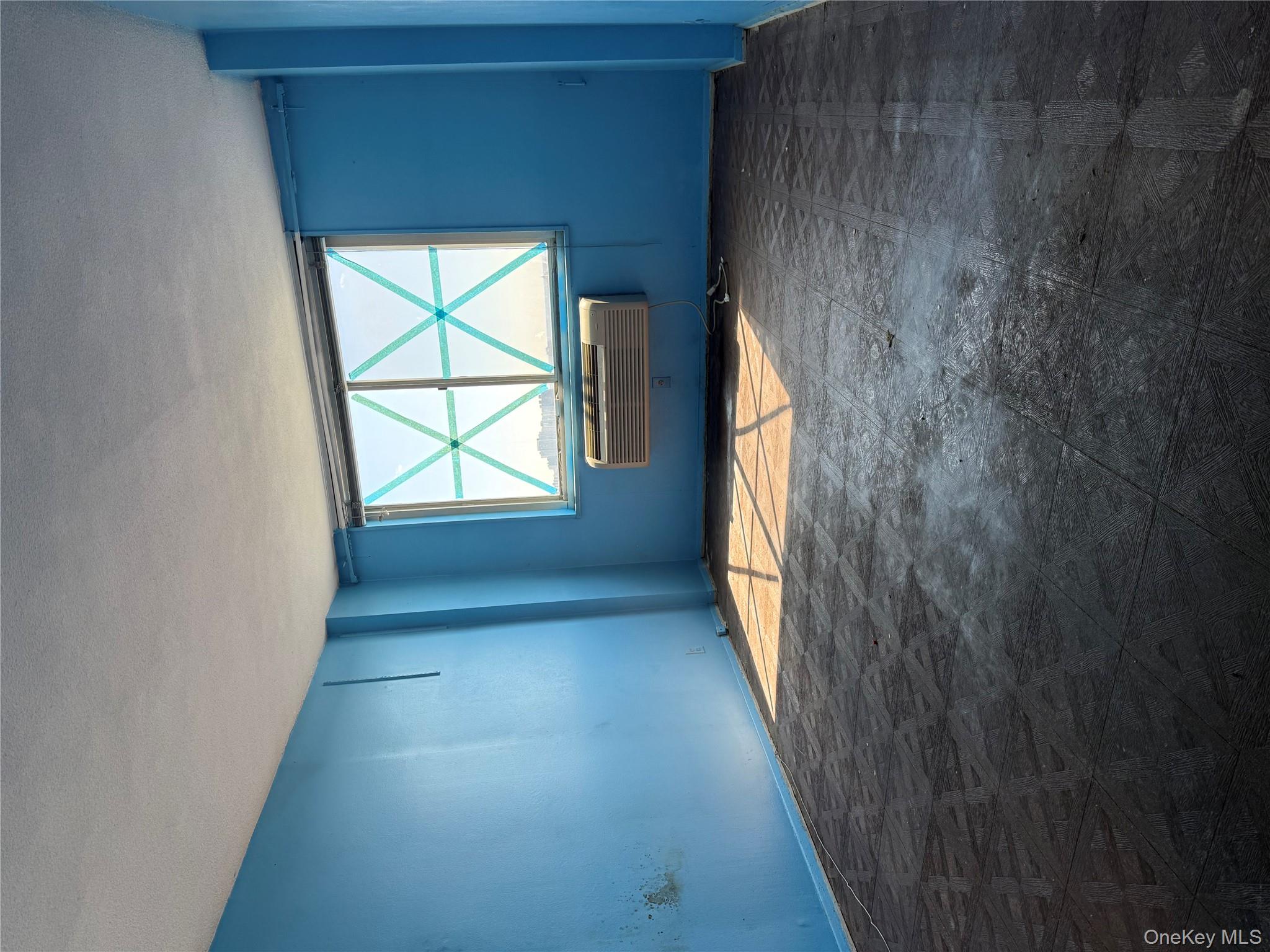 118-18 Union Turnpike, Unit 16A Queens, NY 11415 - Photo 10 of 13 an empty room with a window