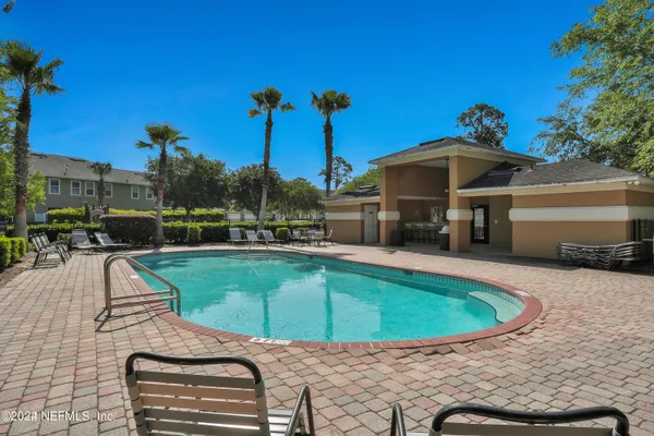 a view of a swimming pool with a patio