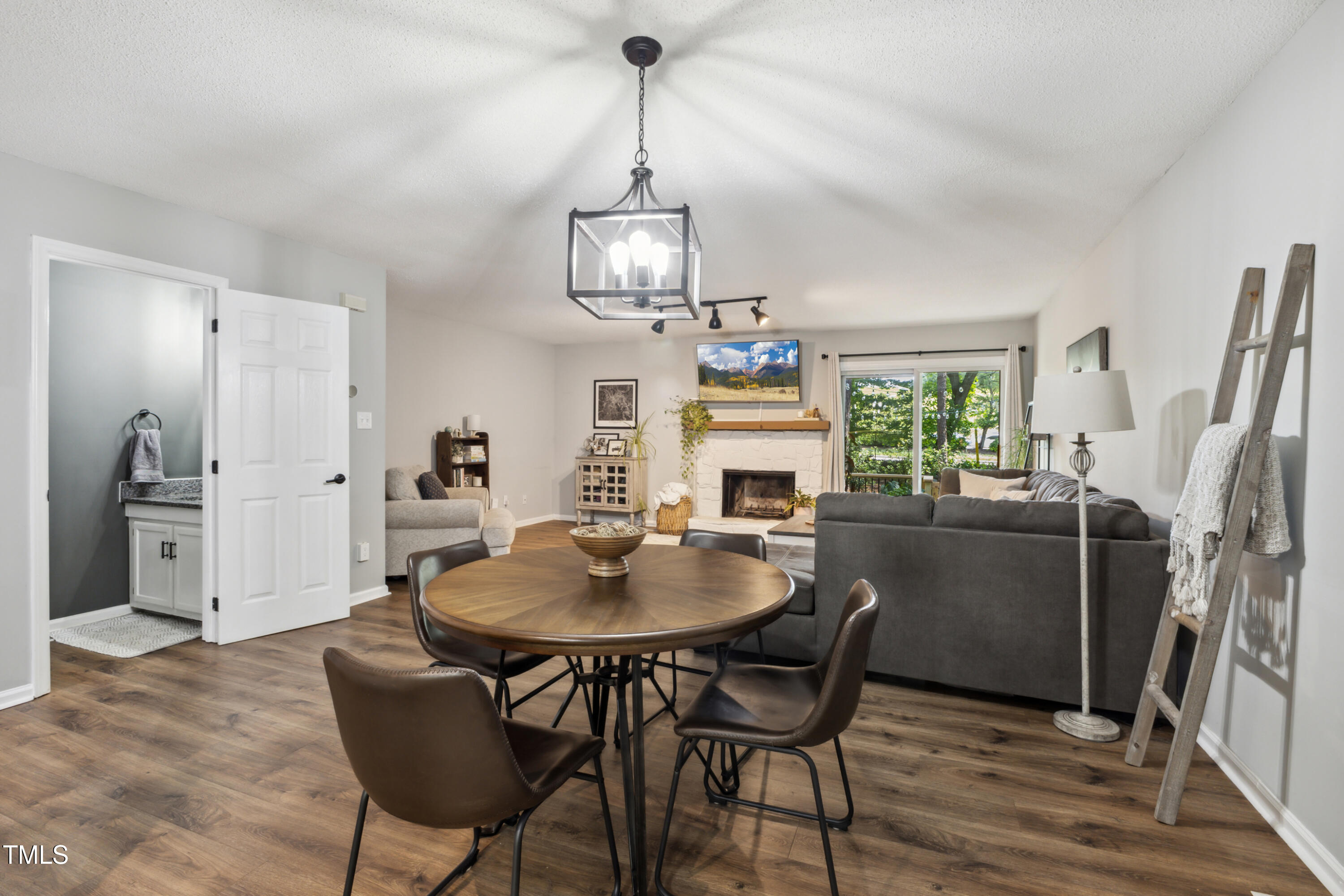 5775 Forest Lawn Court Raleigh, NC 27612 - Photo 11 of 45 a view of a dining room with furniture window and wooden floor