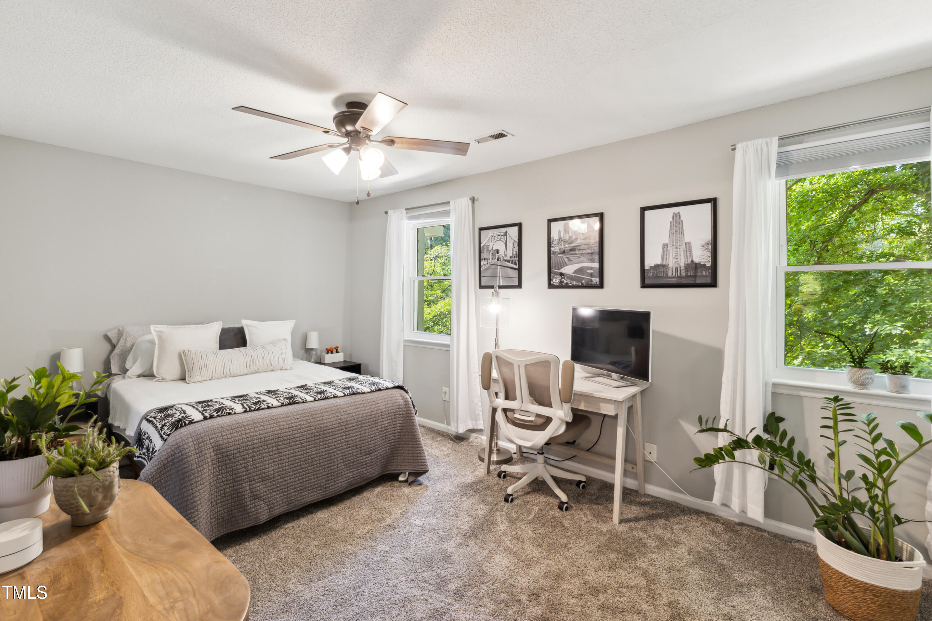 5775 Forest Lawn Court Raleigh, NC 27612 - Photo 23 of 45 a bedroom with a bed and a window