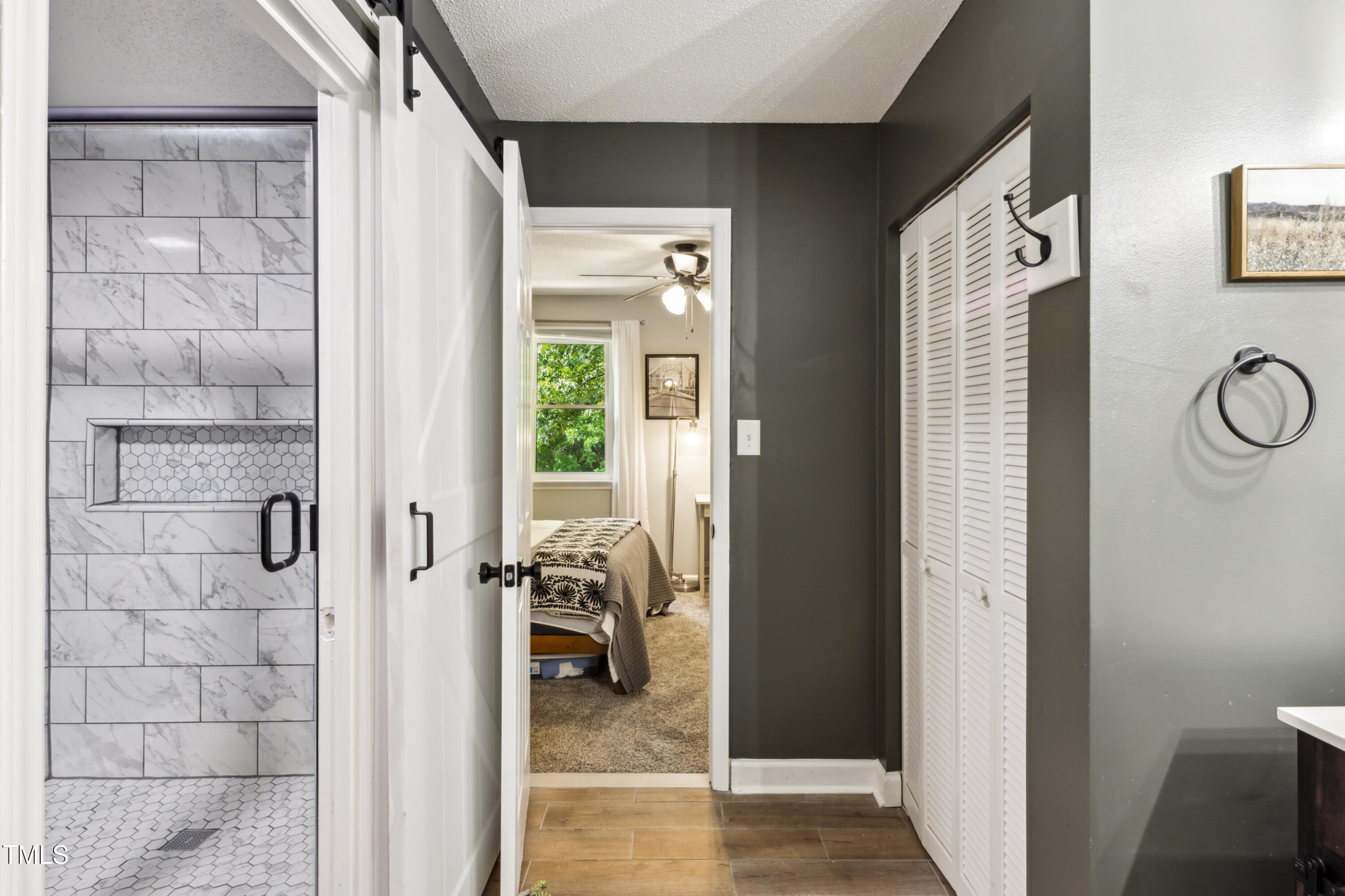 5775 Forest Lawn Court Raleigh, NC 27612 - Photo 28 of 45 a view of a hallway with a livingroom and a bathroom