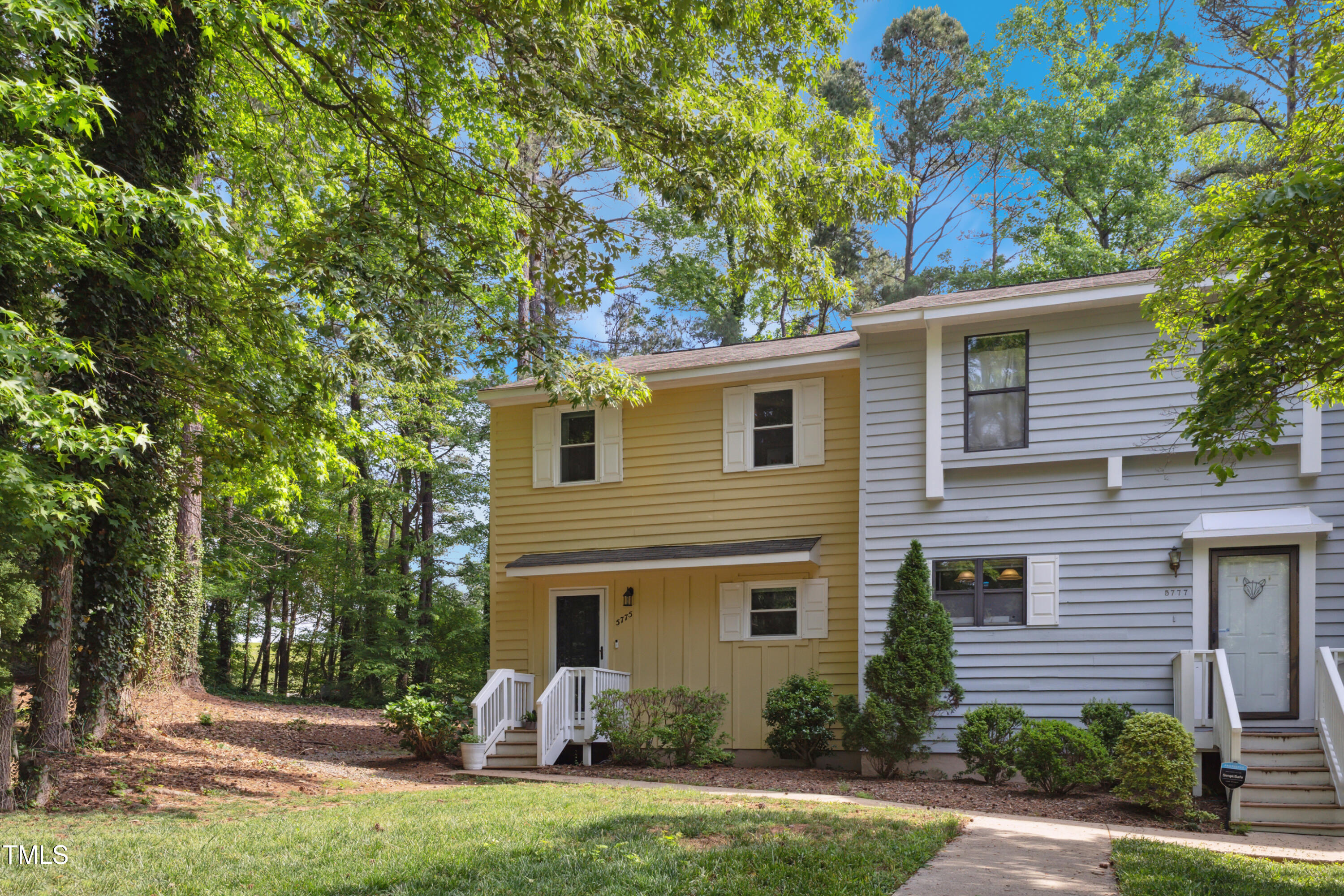 5775 Forest Lawn Court Raleigh, NC 27612 - Photo 3 of 45 a view of a house with backyard sitting area and garden