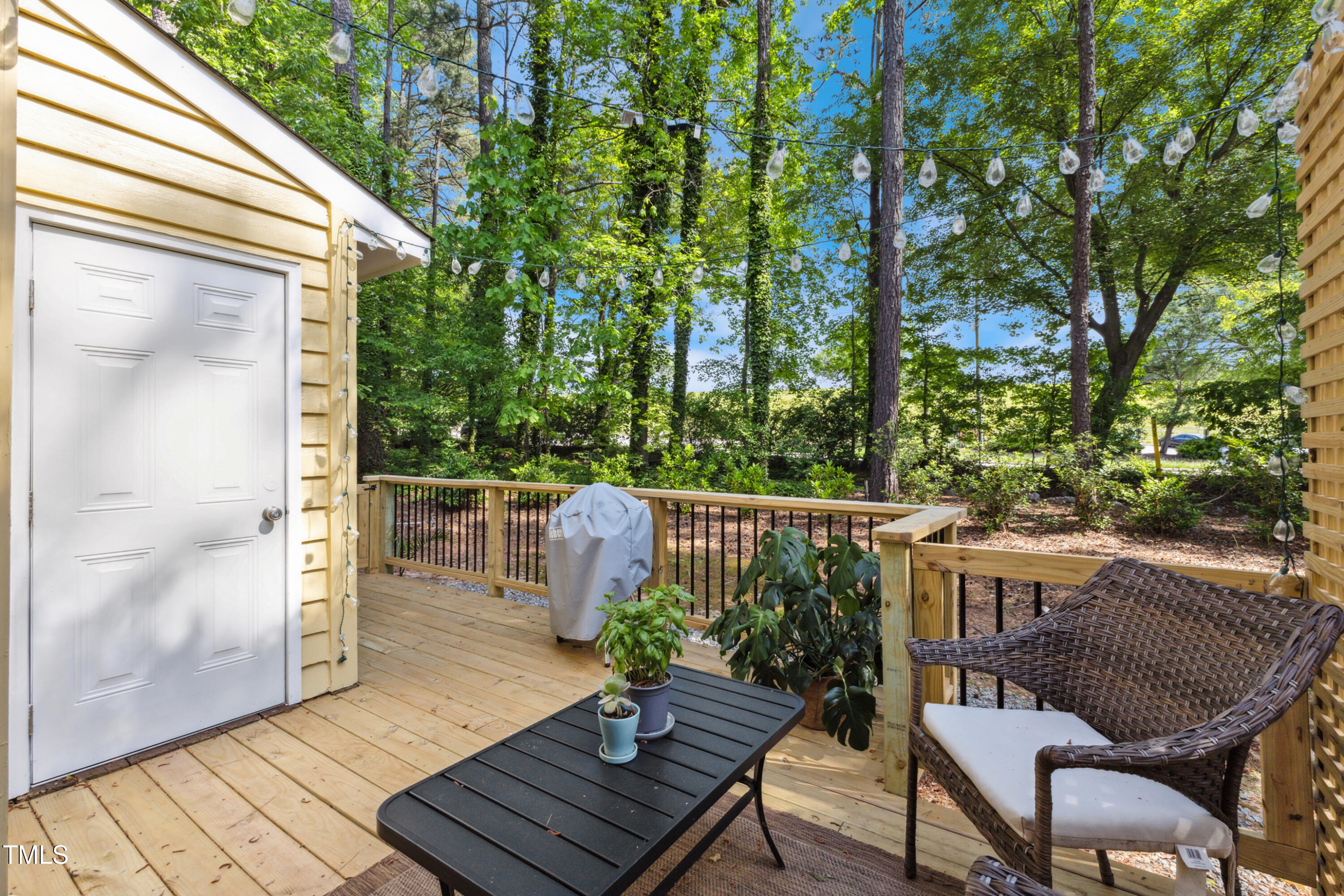 5775 Forest Lawn Court Raleigh, NC 27612 - Photo 33 of 45 a view of balcony with furniture and trees