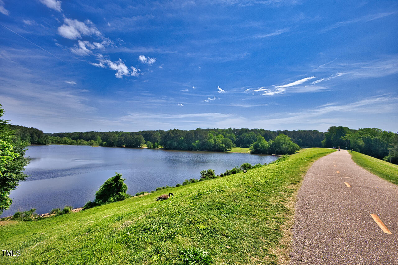 5775 Forest Lawn Court Raleigh, NC 27612 - Photo 41 of 45 a view of a lake with a big yard