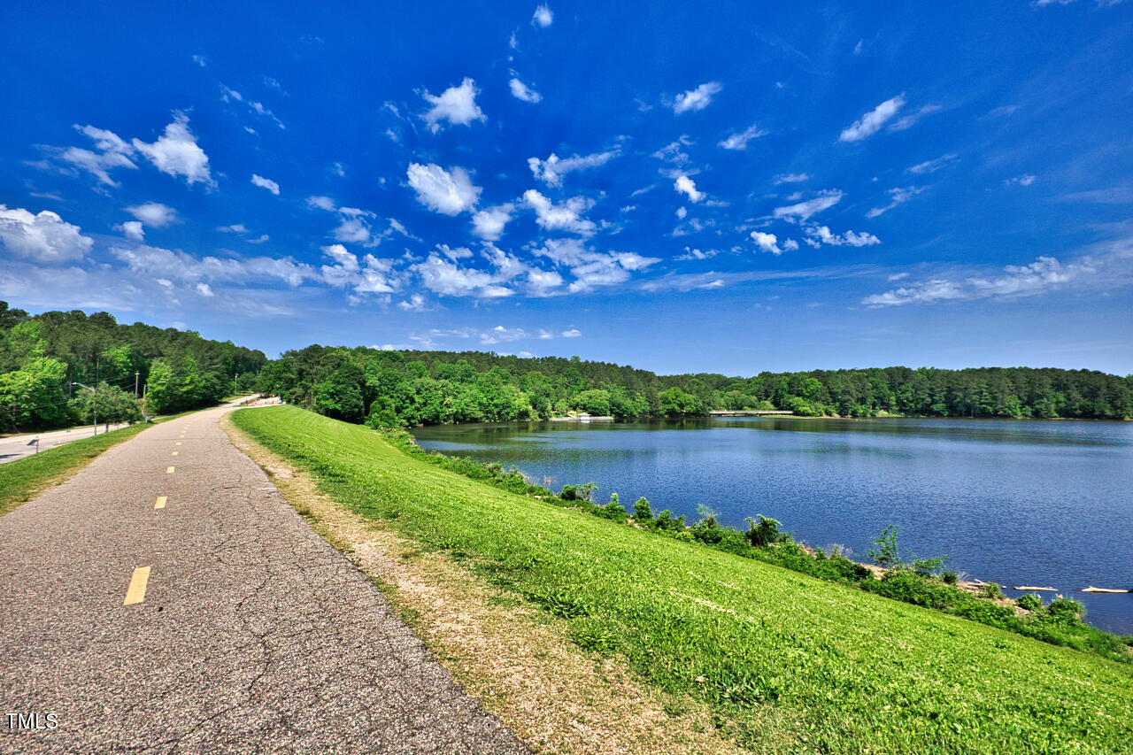 5775 Forest Lawn Court Raleigh, NC 27612 - Photo 42 of 45 a view of a lake with a city