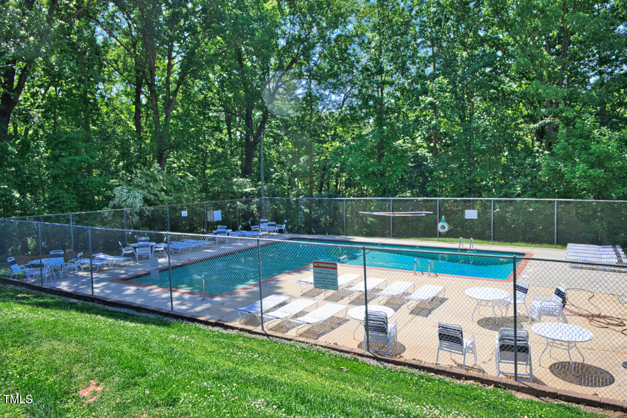 5775 Forest Lawn Court Raleigh, NC 27612 - Photo 45 of 45 a view of a swimming pool with a yard