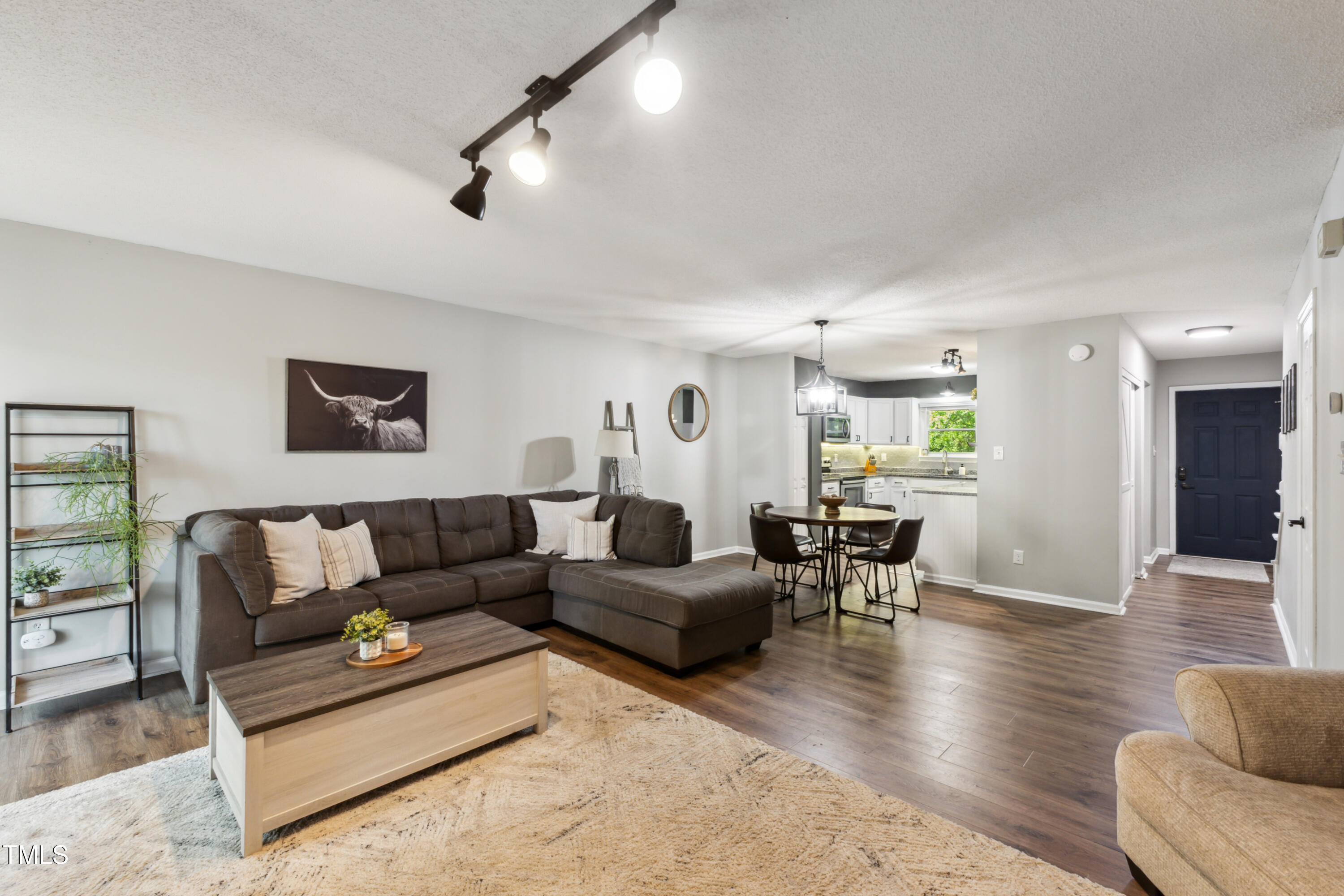5775 Forest Lawn Court Raleigh, NC 27612 - Photo 7 of 45 a living room with furniture and wooden floor