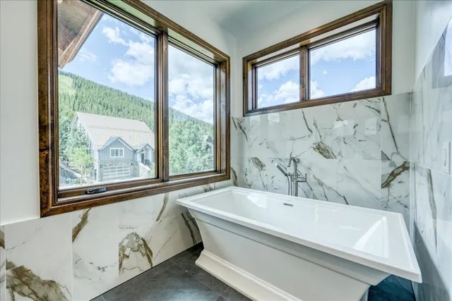 a view of a refrigerator in kitchen and wooden floor