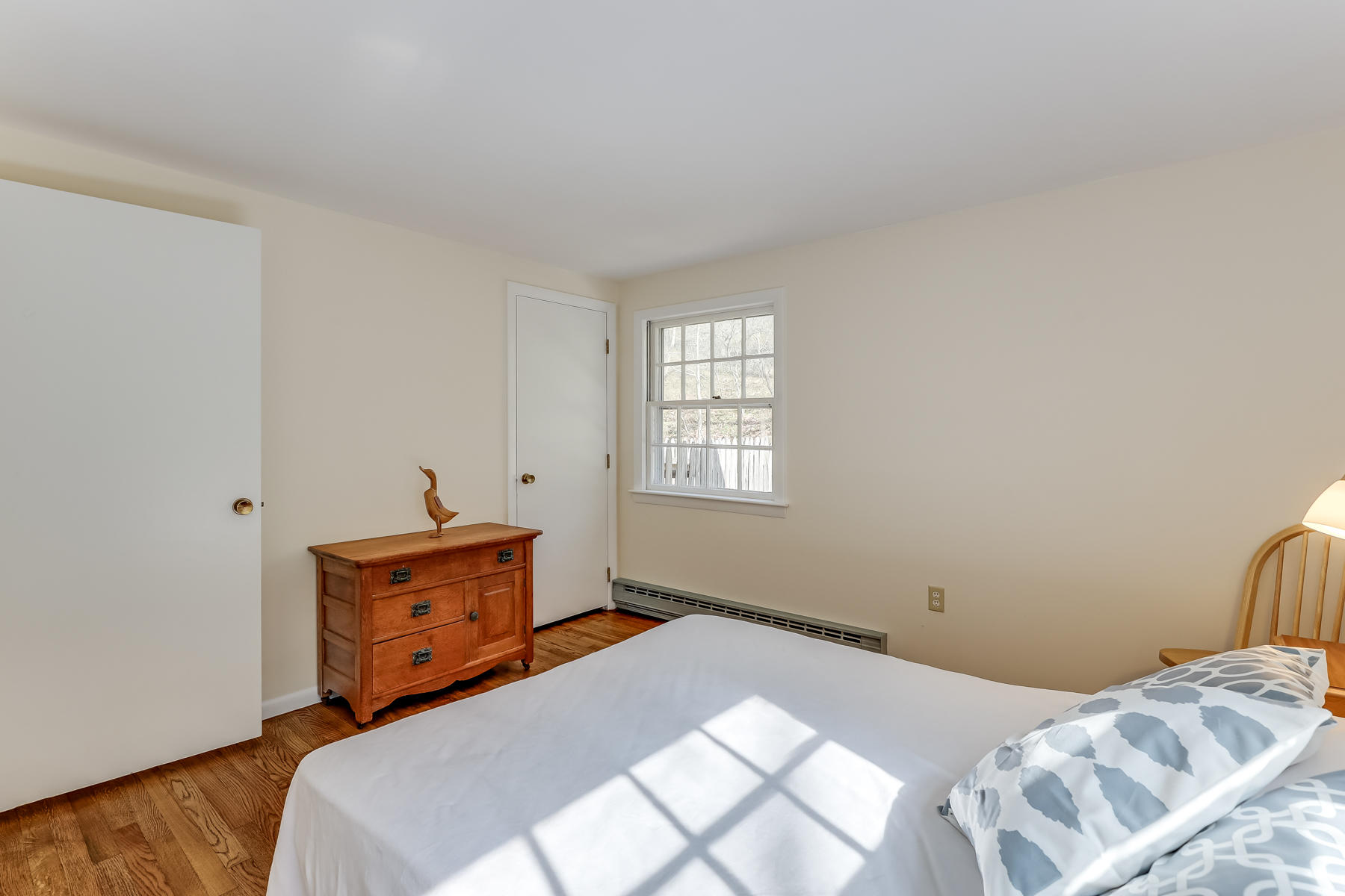 35 Higgins Hollow Road Truro, MA 02666 - Photo 11 of 20 a bedroom with a bed and a window