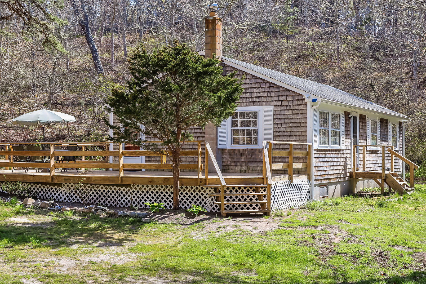 35 Higgins Hollow Road Truro, MA 02666 - Photo 2 of 20 a view of a house with a yard and deck