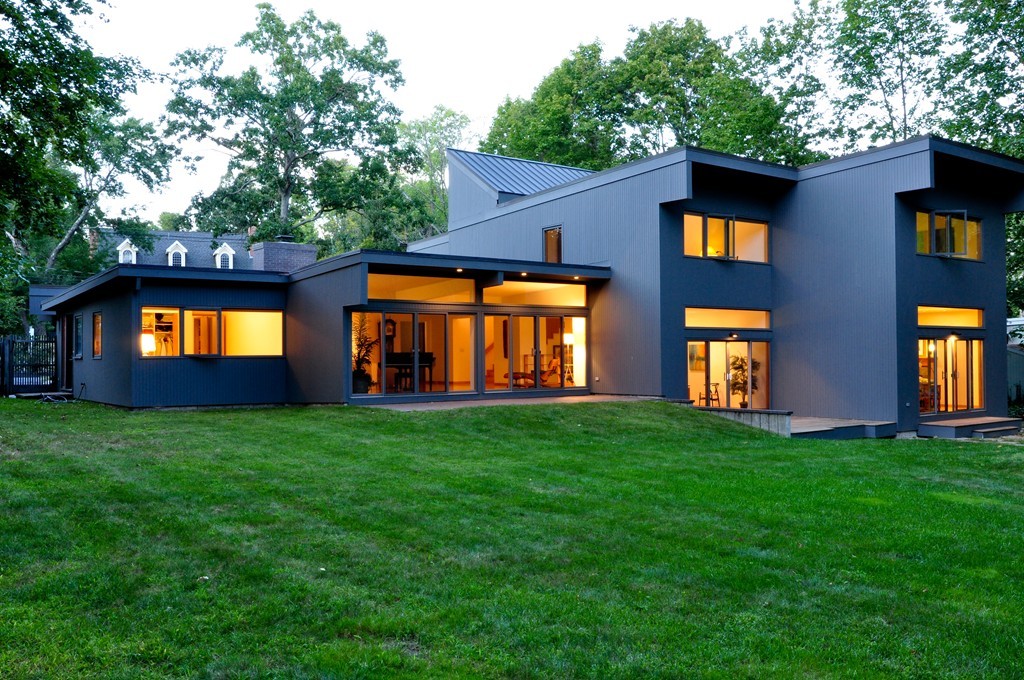 a front view of house with yard and outdoor seating