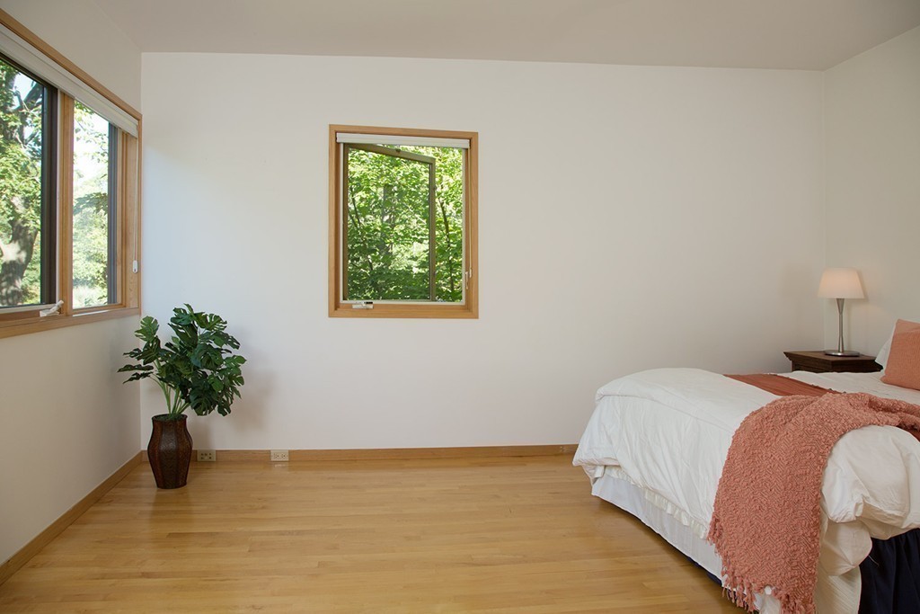 2 Barberry Road Lexington, MA 02421 - Photo 11 of 21 a bed sitting in a bedroom next to a window