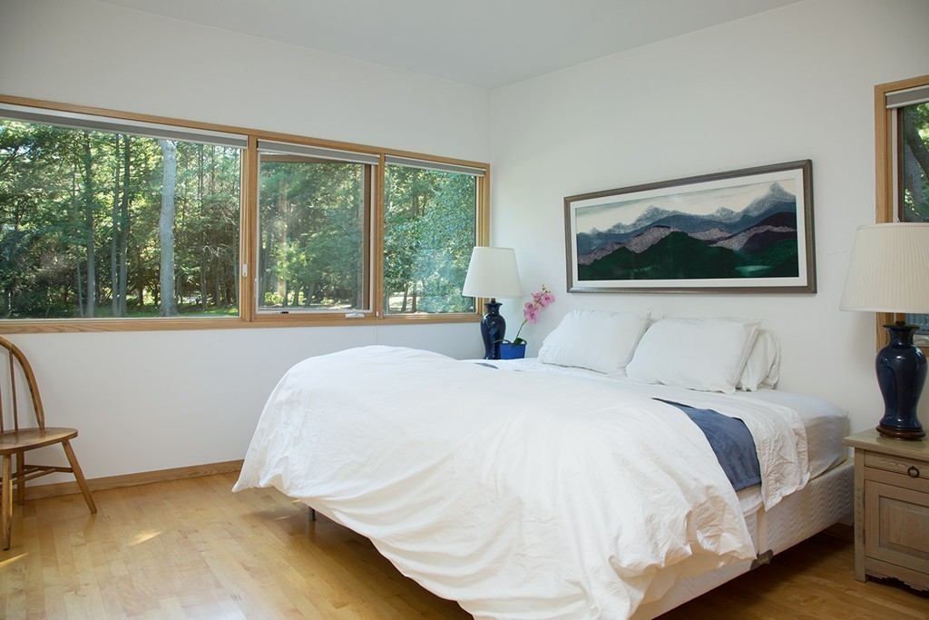 2 Barberry Road Lexington, MA 02421 - Photo 12 of 21 a bedroom with a bed and a large window