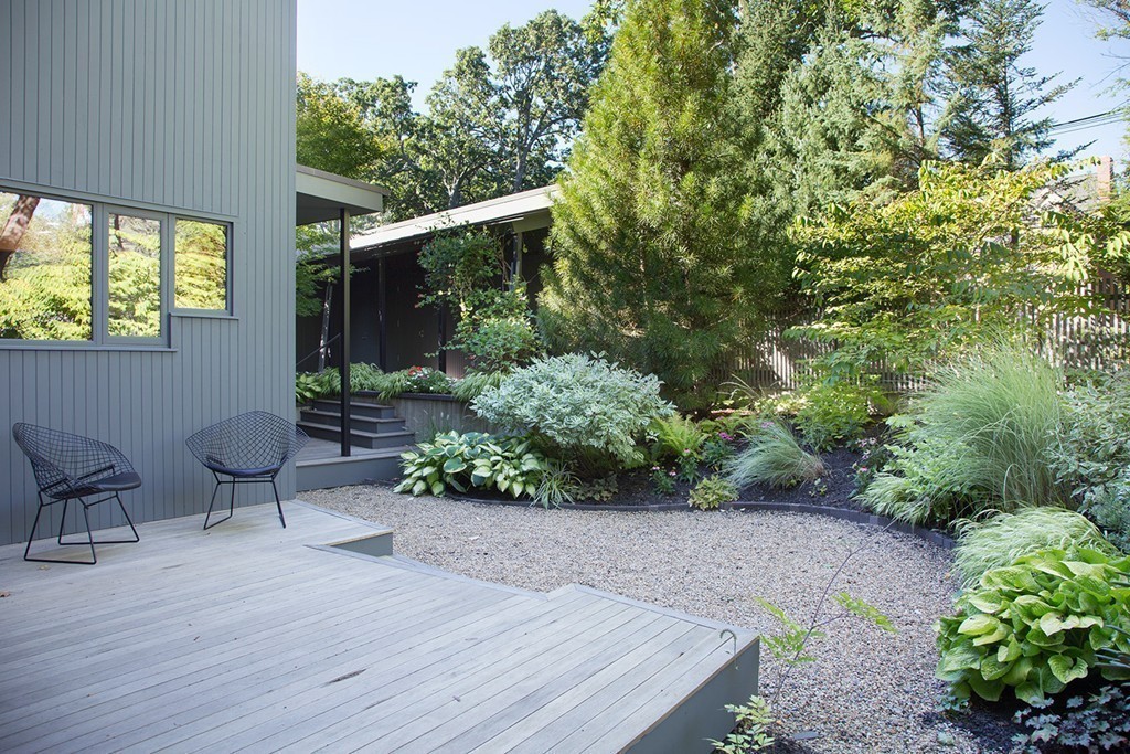 2 Barberry Road Lexington, MA 02421 - Photo 14 of 21 a view of a chair and table in the garden