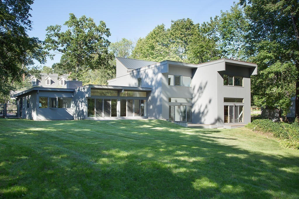 2 Barberry Road Lexington, MA 02421 - Photo 17 of 21 a front view of a house with a garden