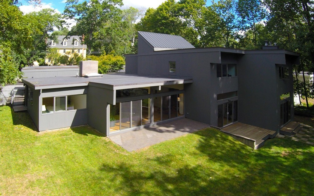 2 Barberry Road Lexington, MA 02421 - Photo 19 of 21 a view of a house with a yard and sitting area