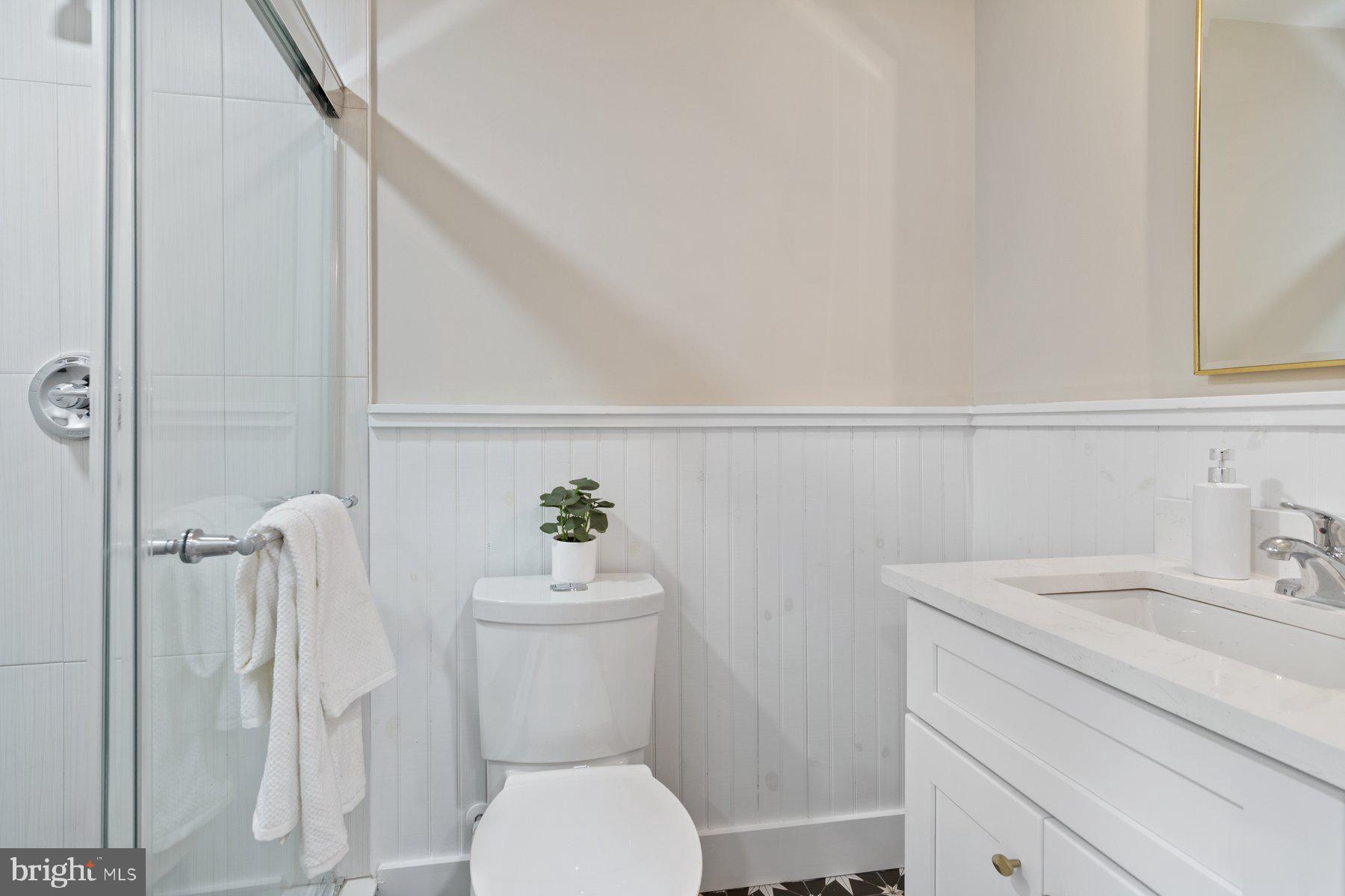 509 Valcour Road Catonsville, MD 21228 - Photo 12 of 40 a white toilet sitting next to a bathroom sink