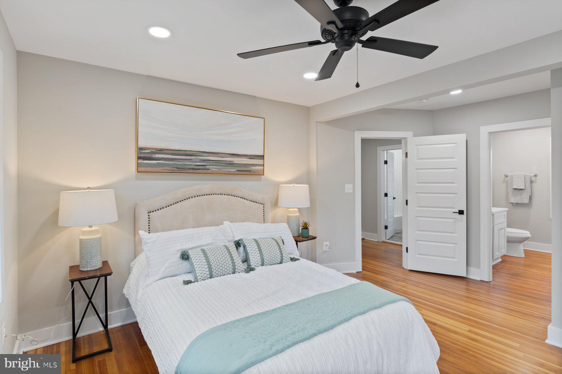 509 Valcour Road Catonsville, MD 21228 - Photo 15 of 40 a bedroom with a bed and a chandelier