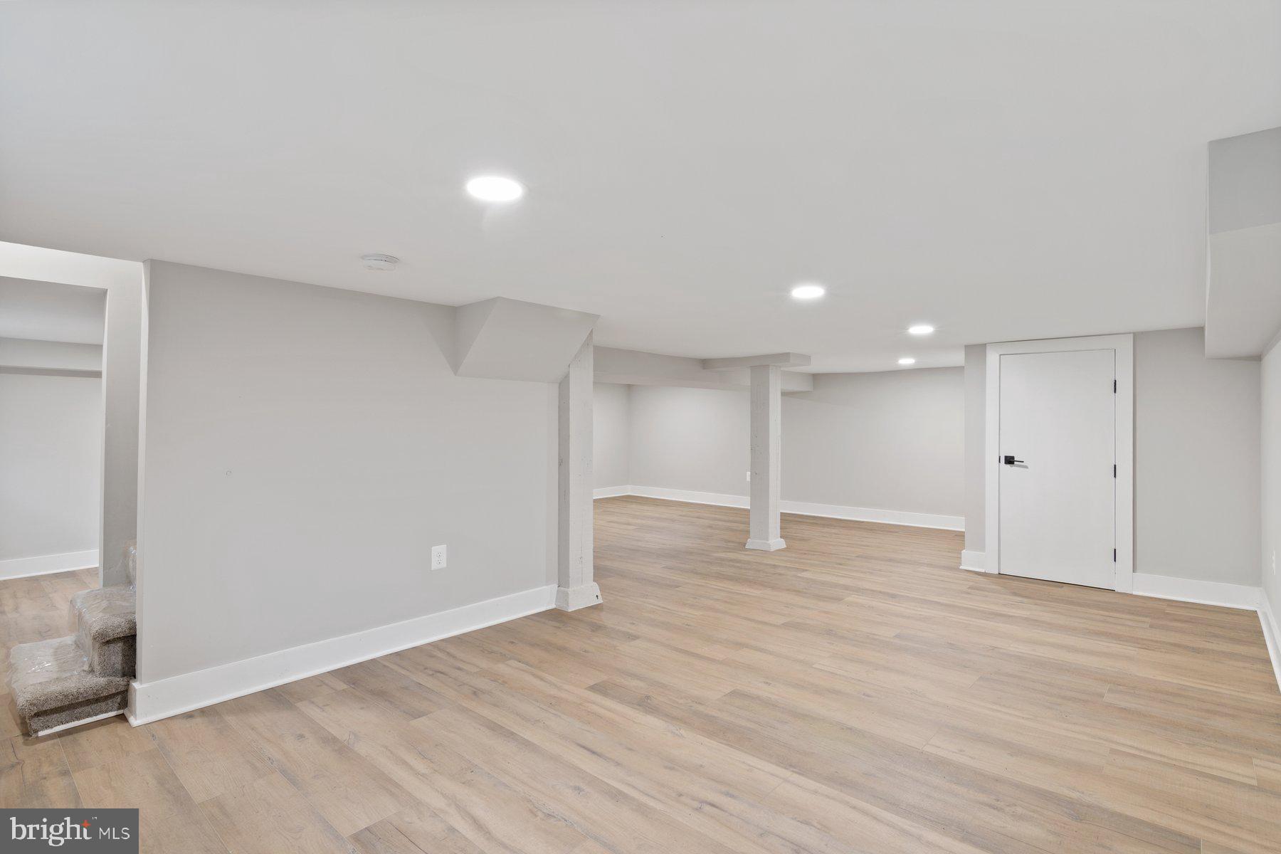 509 Valcour Road Catonsville, MD 21228 - Photo 26 of 40 a view of an empty room with wooden floor