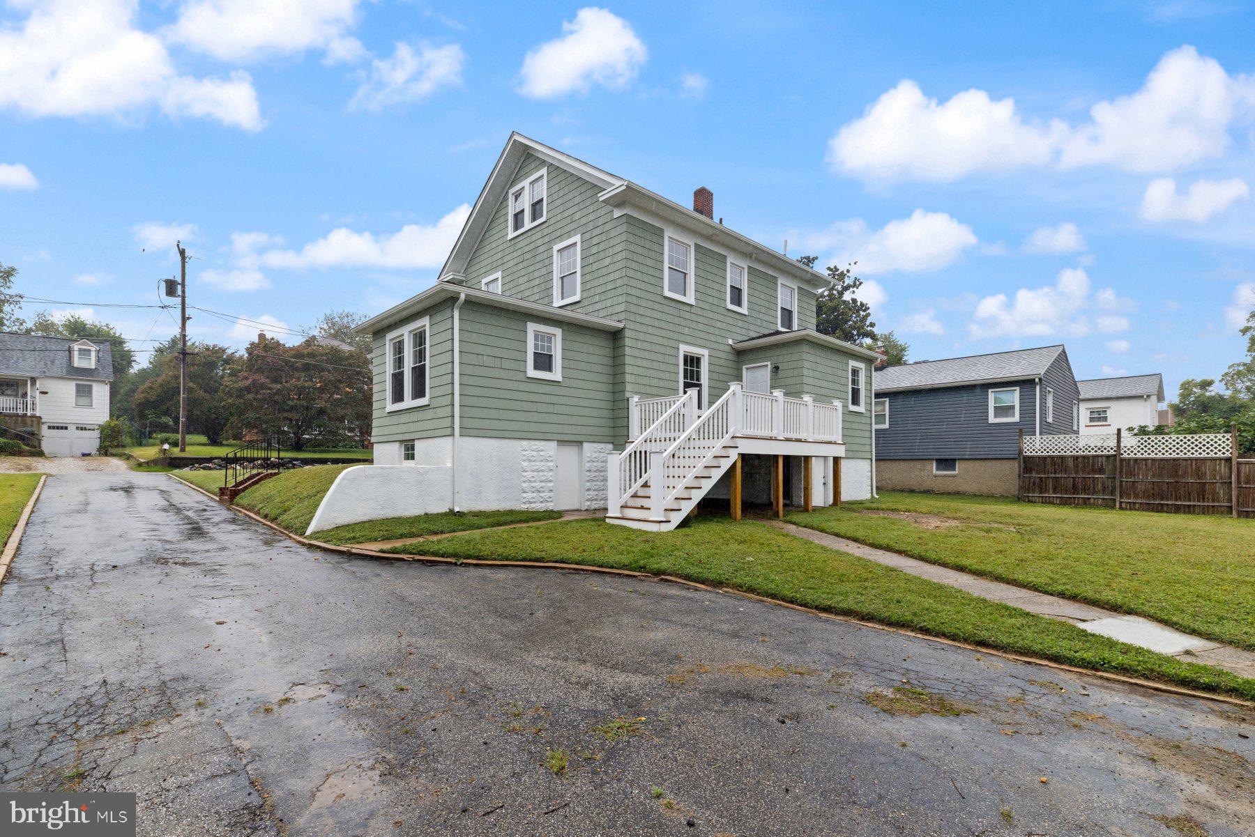 509 Valcour Road Catonsville, MD 21228 - Photo 29 of 40 a view of a house with a big yard and a large tree