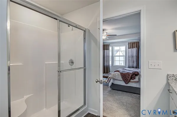 a bed room with a bed and a window