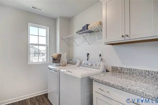 a utility room with cabinets