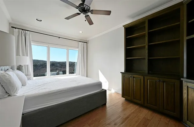 a bedroom with a bed closet and a window