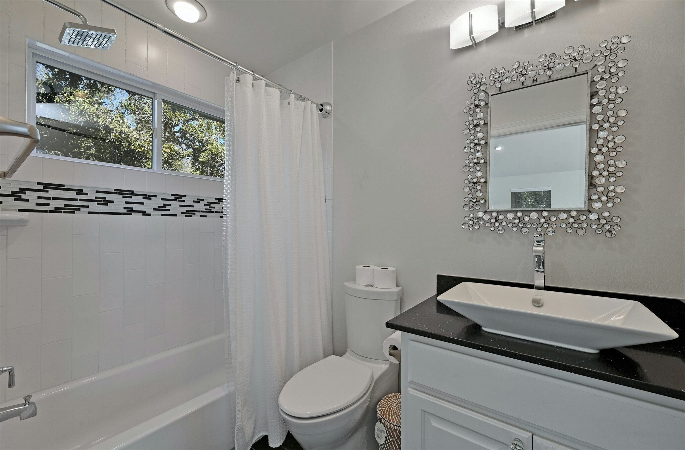 5606 Craggy Point Austin, TX 78731 - Photo 20 of 39 a bathroom with a sink toilet and shower