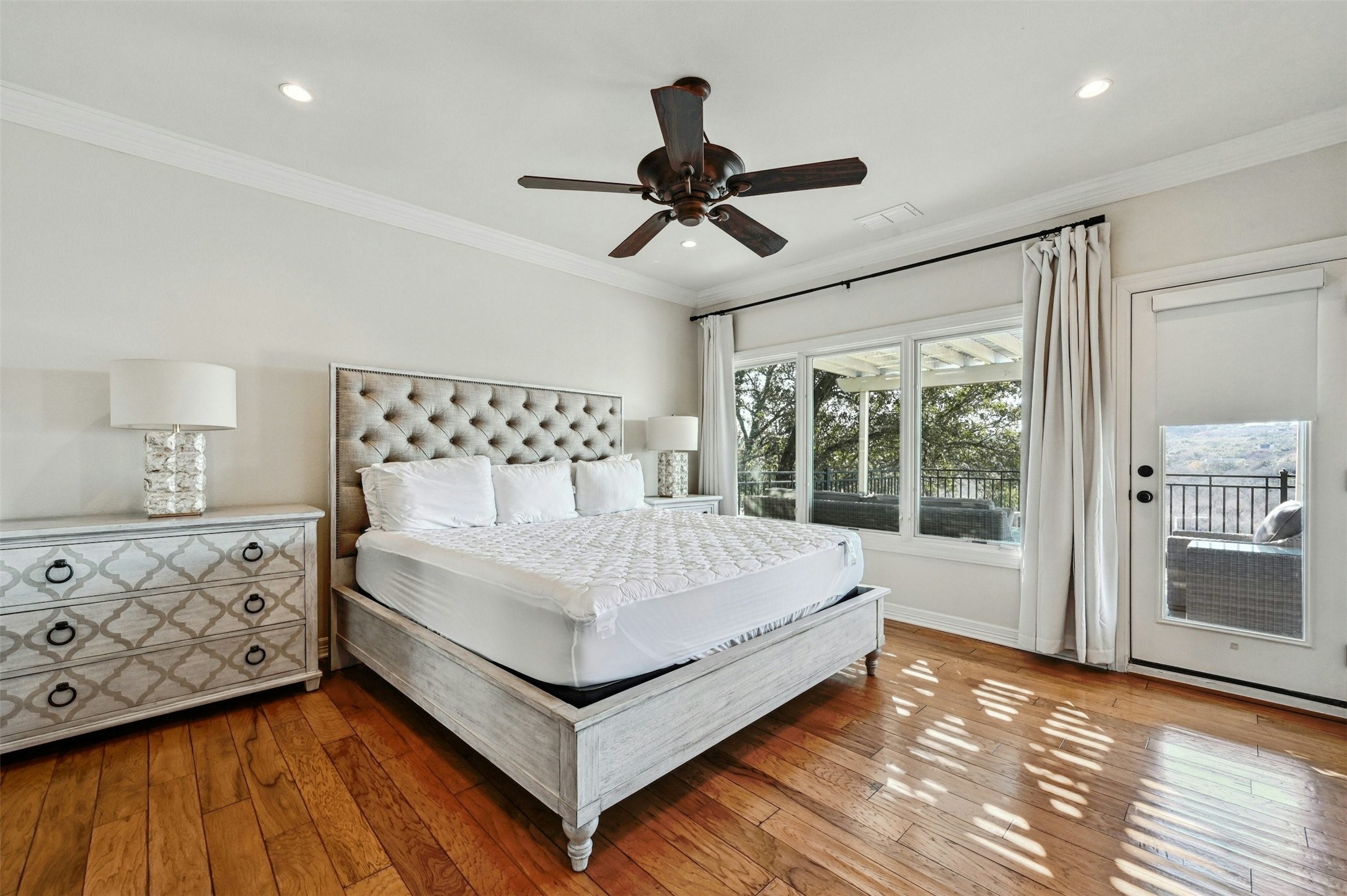 5606 Craggy Point Austin, TX 78731 - Photo 29 of 39 a white bed sitting in a bedroom next to a window