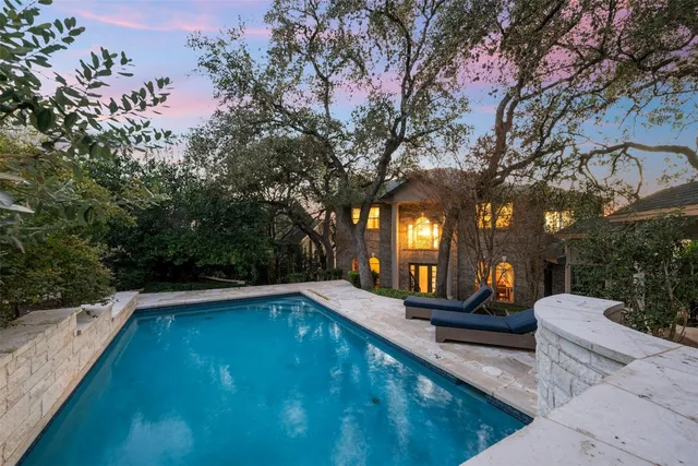 a view of a swimming pool with lounge chair