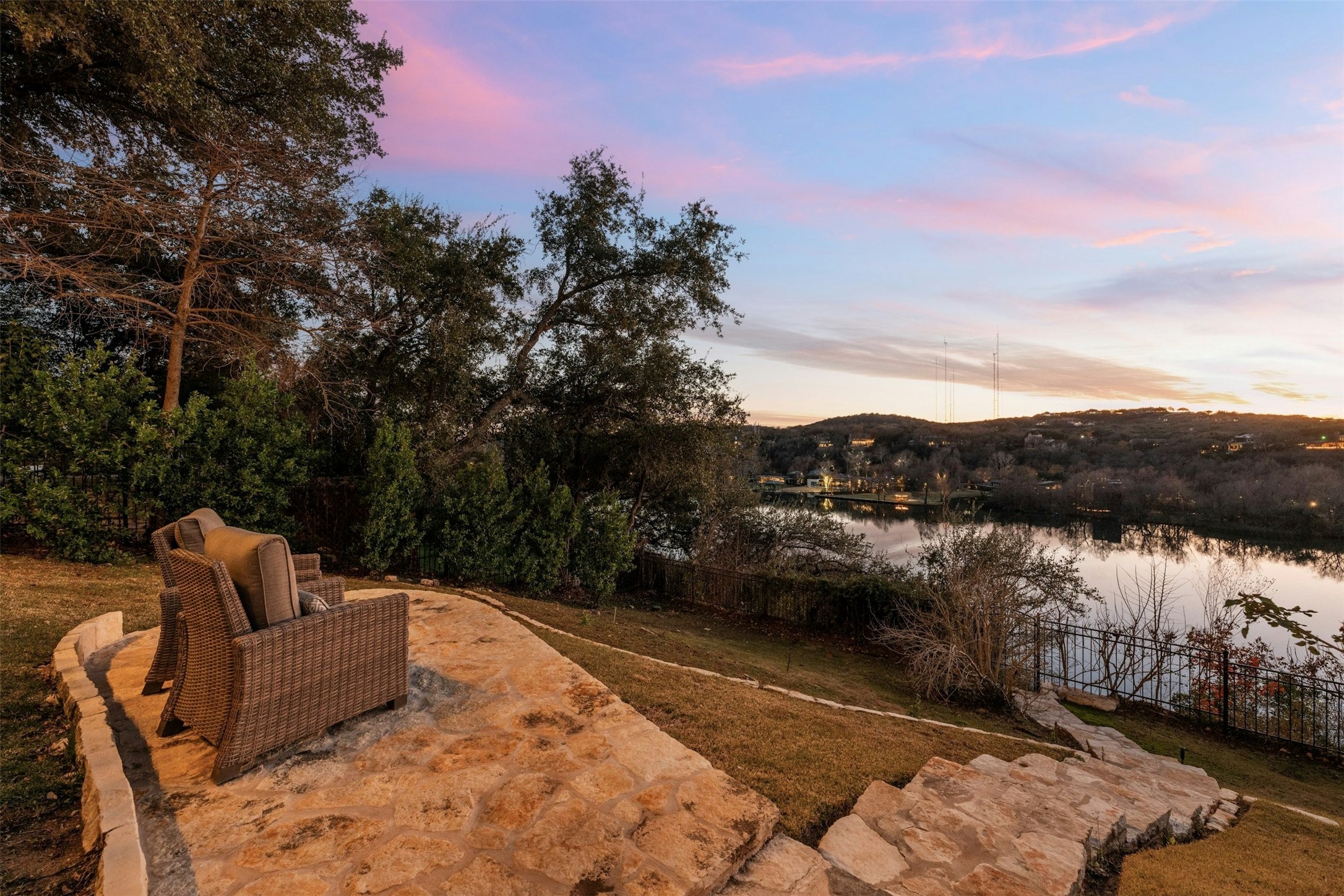 5606 Craggy Point Austin, TX 78731 - Photo 33 of 39 a view of a lake with a house in the background