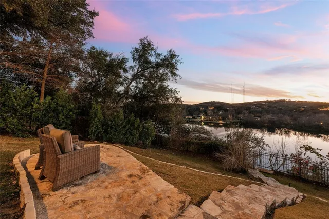a view of a lake with a house in the background