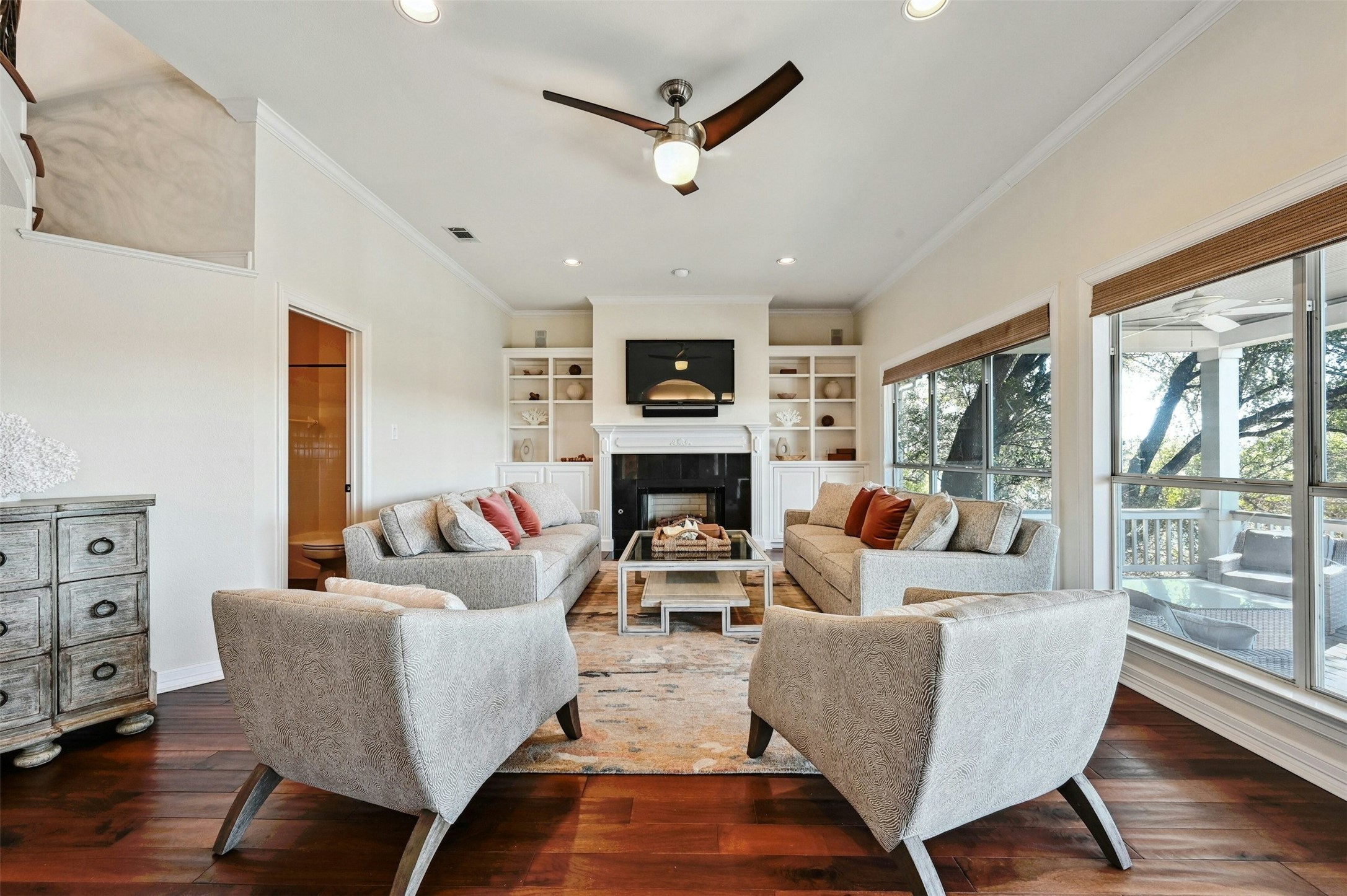 5606 Craggy Point Austin, TX 78731 - Photo 4 of 39 a living room with furniture a flat screen tv and a fireplace