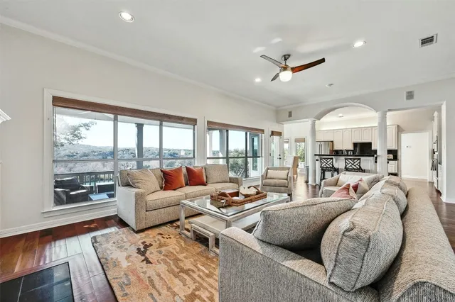 a living room with furniture and a large window