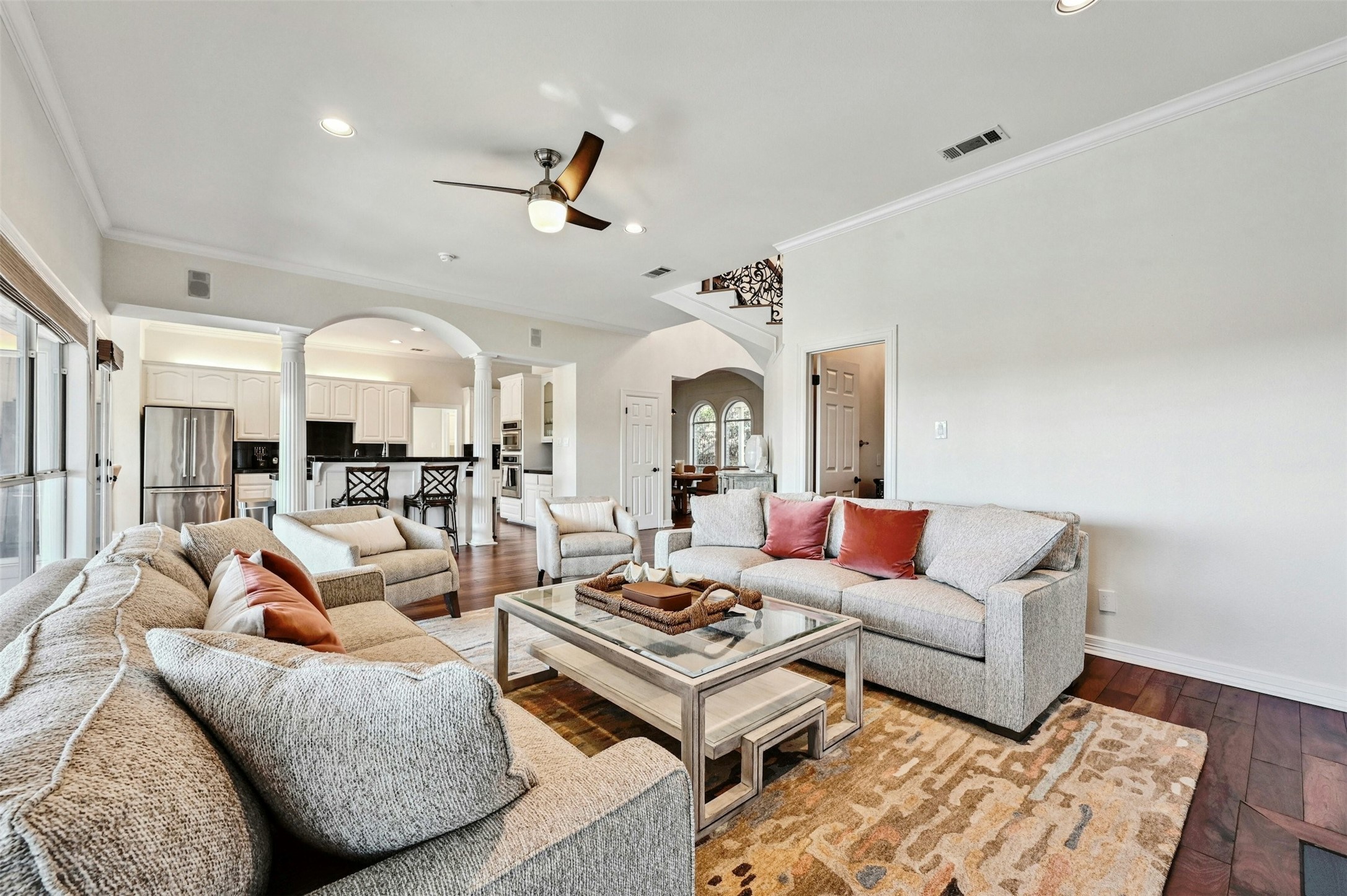 5606 Craggy Point Austin, TX 78731 - Photo 7 of 39 a living room with furniture ceiling fan and a rug
