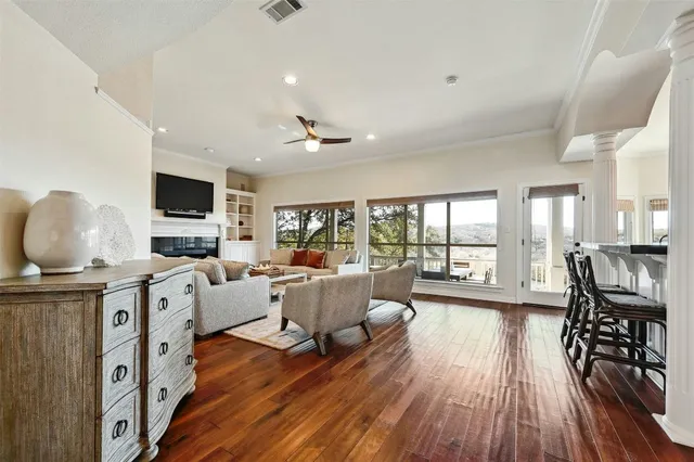 a living room with furniture fireplace and flat screen tv