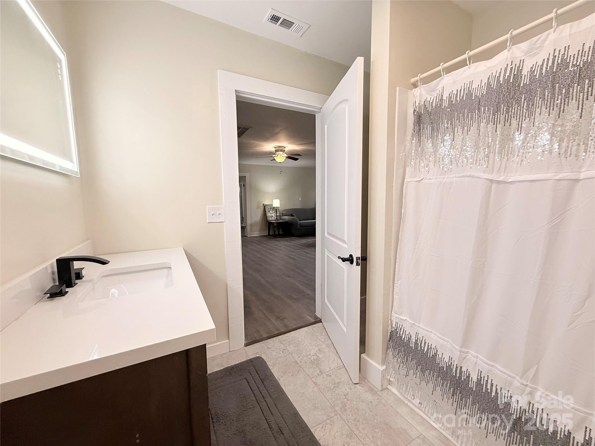 3465 Peniel Road Tryon, NC 28782 - Photo 13 of 21 a bathroom with a sink and mirror
