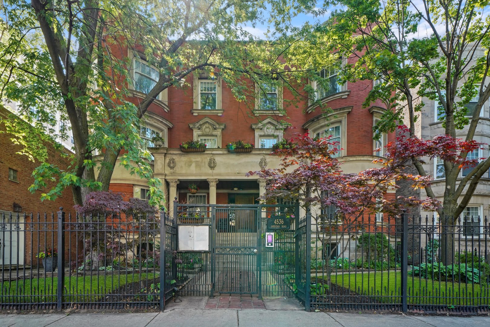front view of a house with a garden