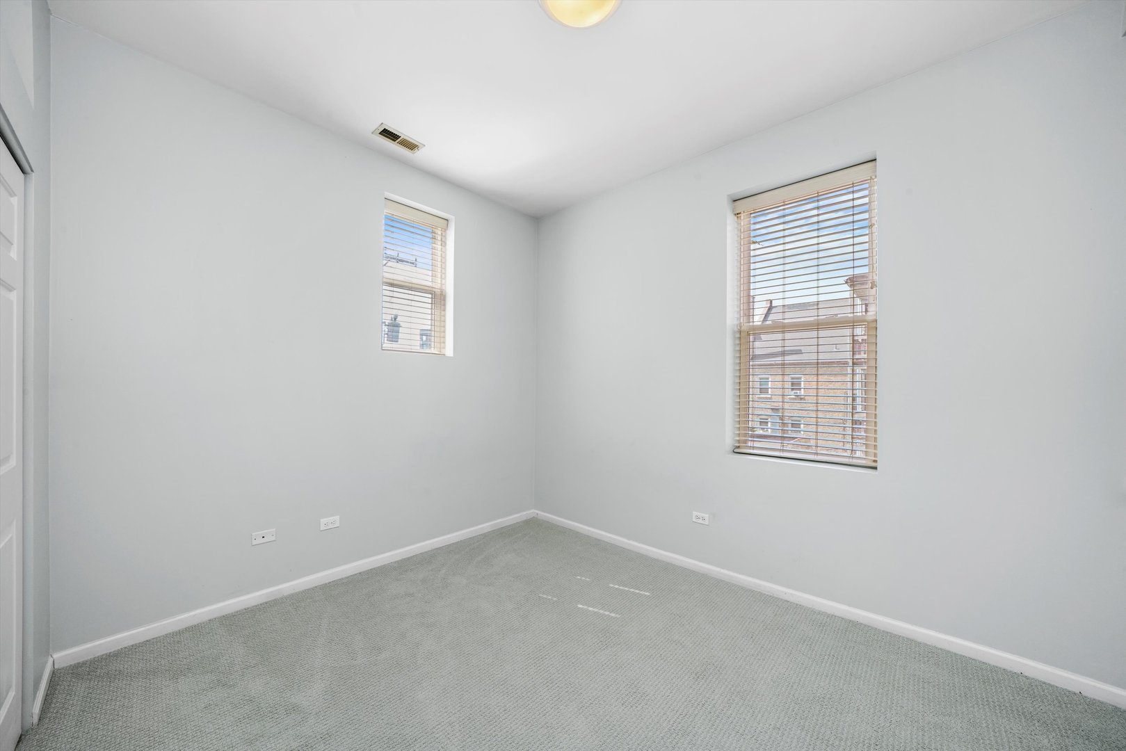 4536 North Sheridan Road, Unit 204 Chicago, IL 60640 - Photo 19 of 24 an empty room with windows