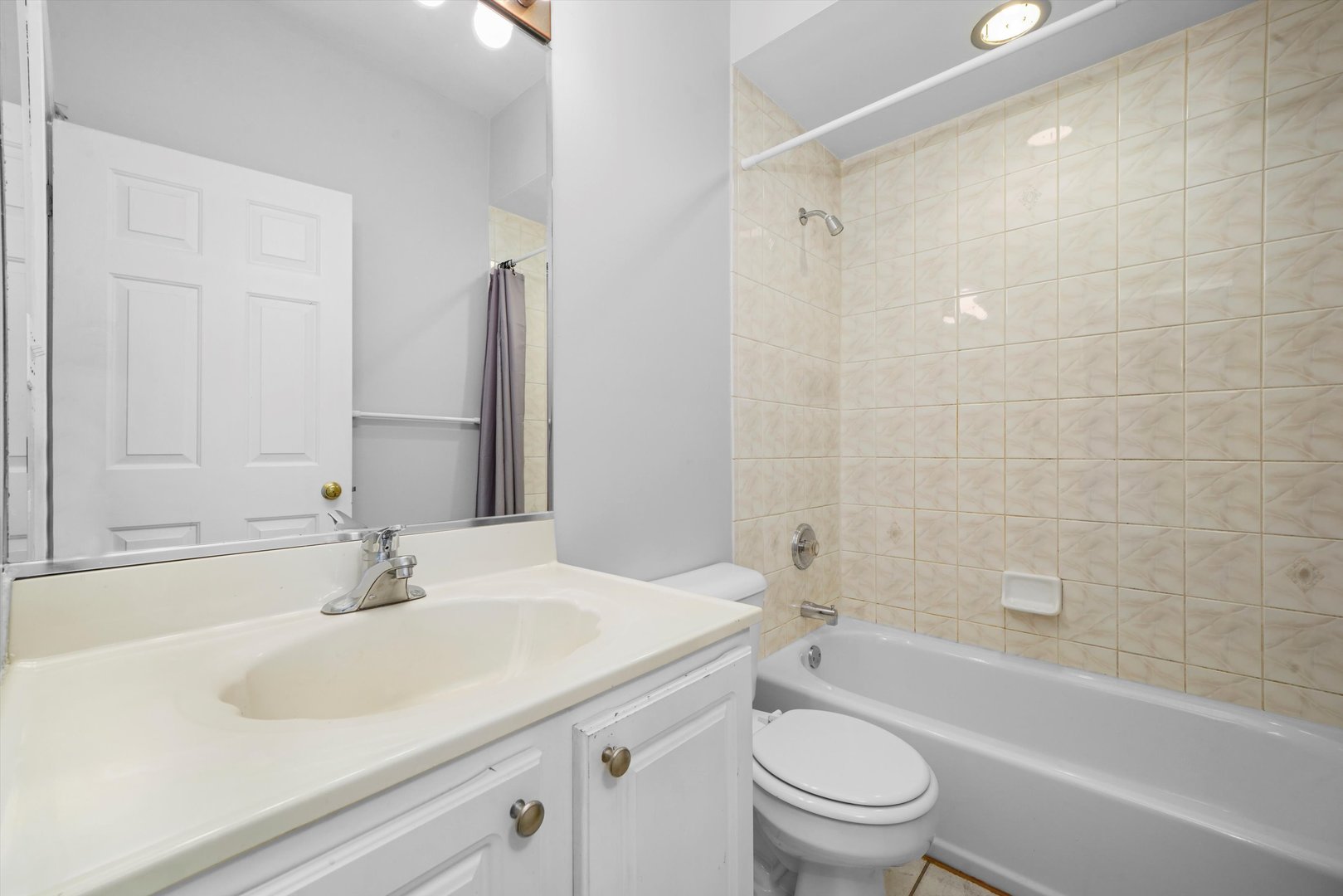 4536 North Sheridan Road, Unit 204 Chicago, IL 60640 - Photo 20 of 24 a bathroom with a sink a toilet and shower