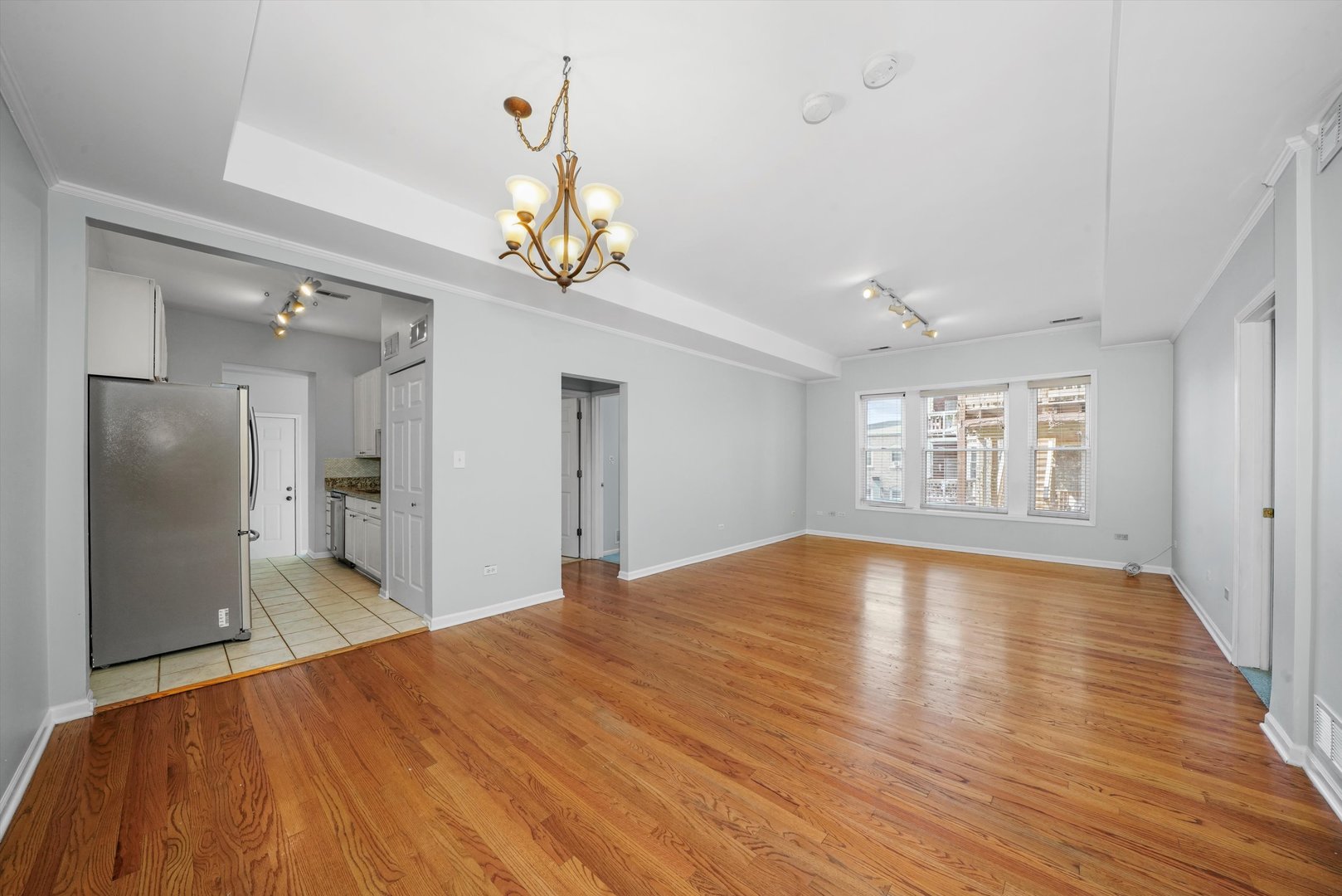4536 North Sheridan Road, Unit 204 Chicago, IL 60640 - Photo 2 of 24 a view of a livingroom with a chandelier