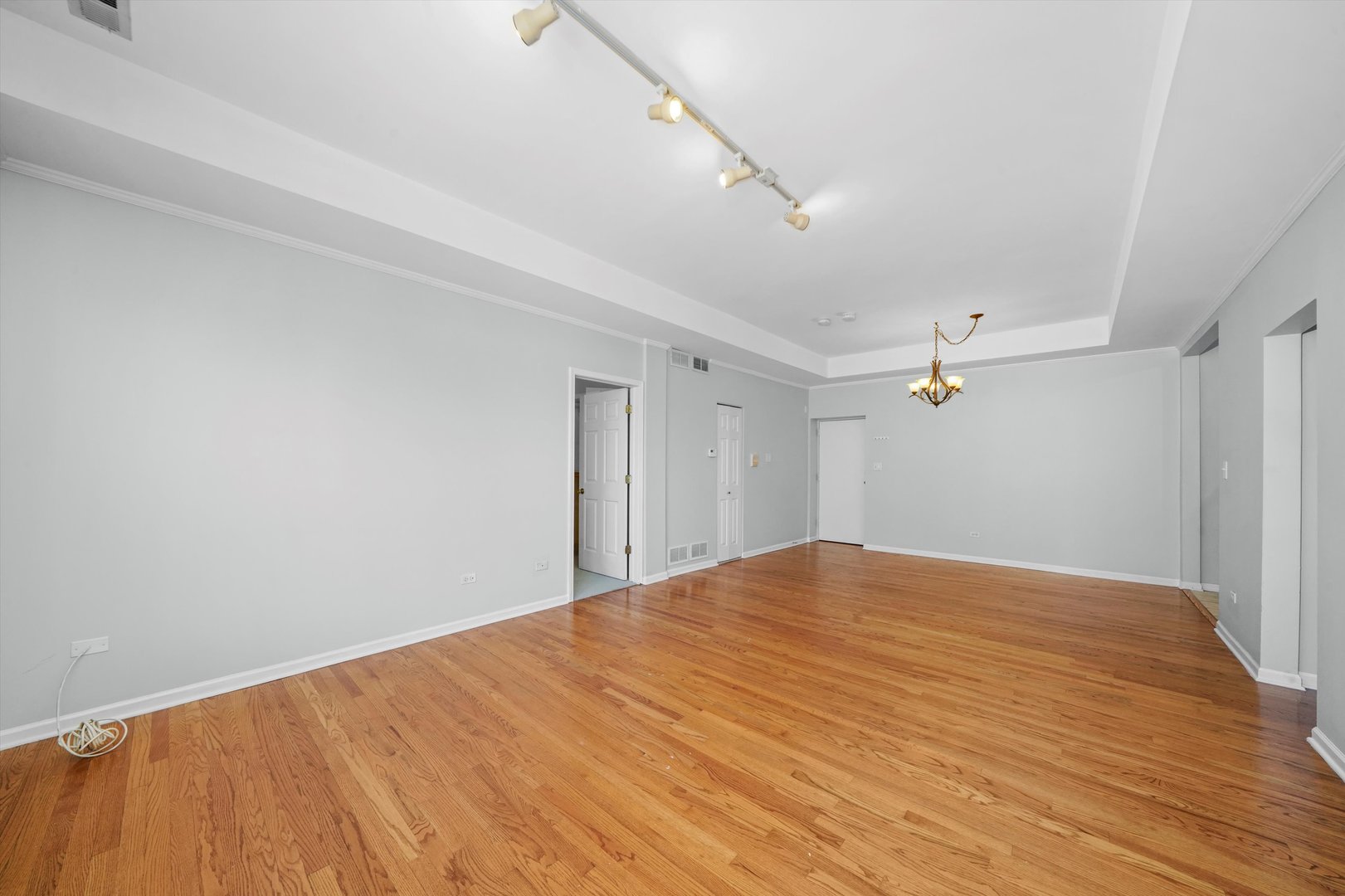 4536 North Sheridan Road, Unit 204 Chicago, IL 60640 - Photo 5 of 24 a view of empty room with wooden floor