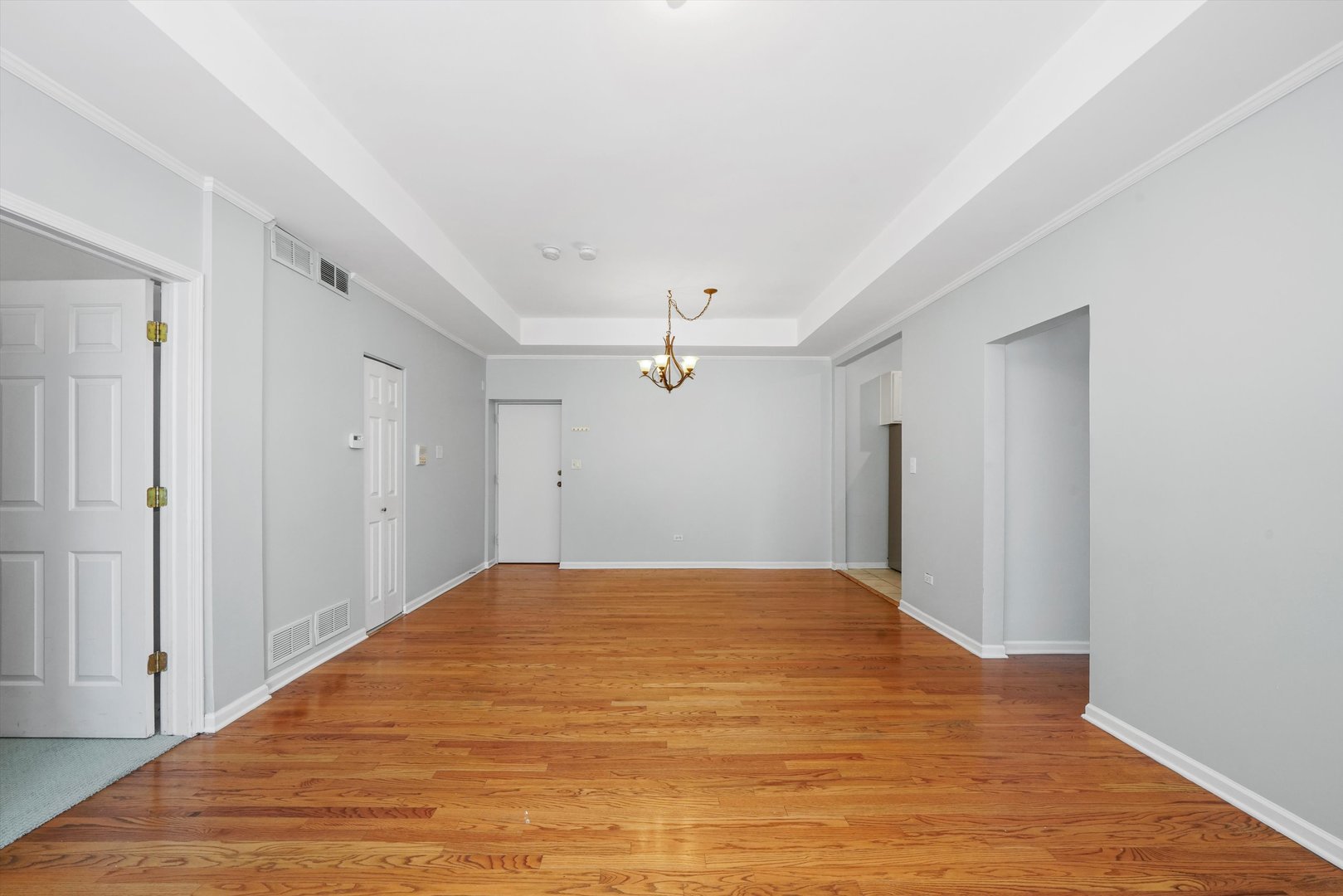 4536 North Sheridan Road, Unit 204 Chicago, IL 60640 - Photo 6 of 24 a view of a big room with closet and a ceiling fan