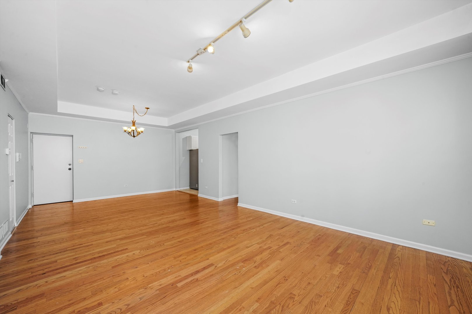 4536 North Sheridan Road, Unit 204 Chicago, IL 60640 - Photo 7 of 24 a view of empty room with wooden floor